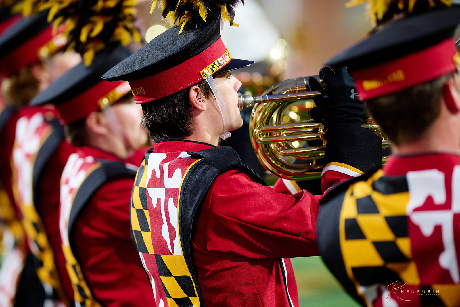 Horn players from the Mighty Sound of Maryland. They are in uniform and playing their horns bells up.