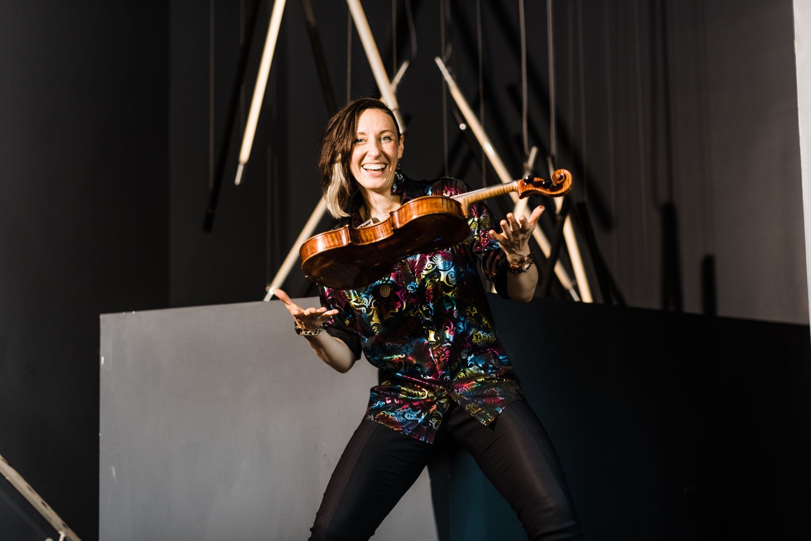 Lauren Spaulding excitedly hold her instrument
